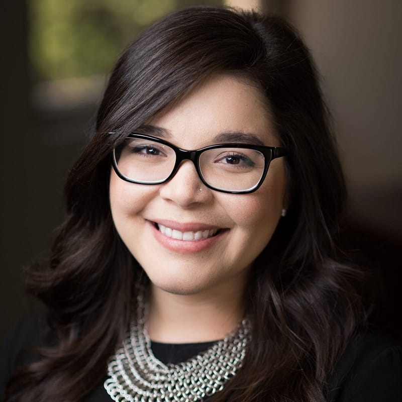 Tianna Schanck's headshot in office space.