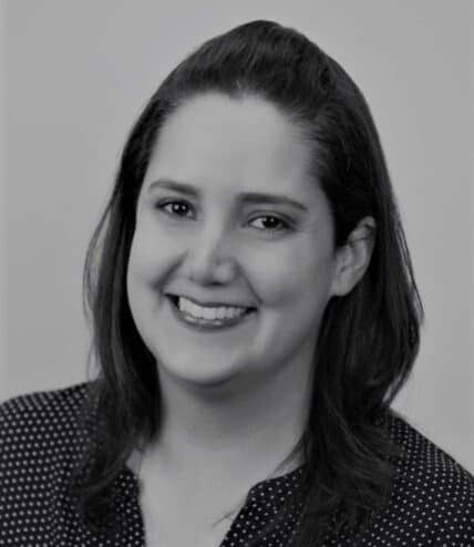 A headshot of Tanya Valle in black and white.