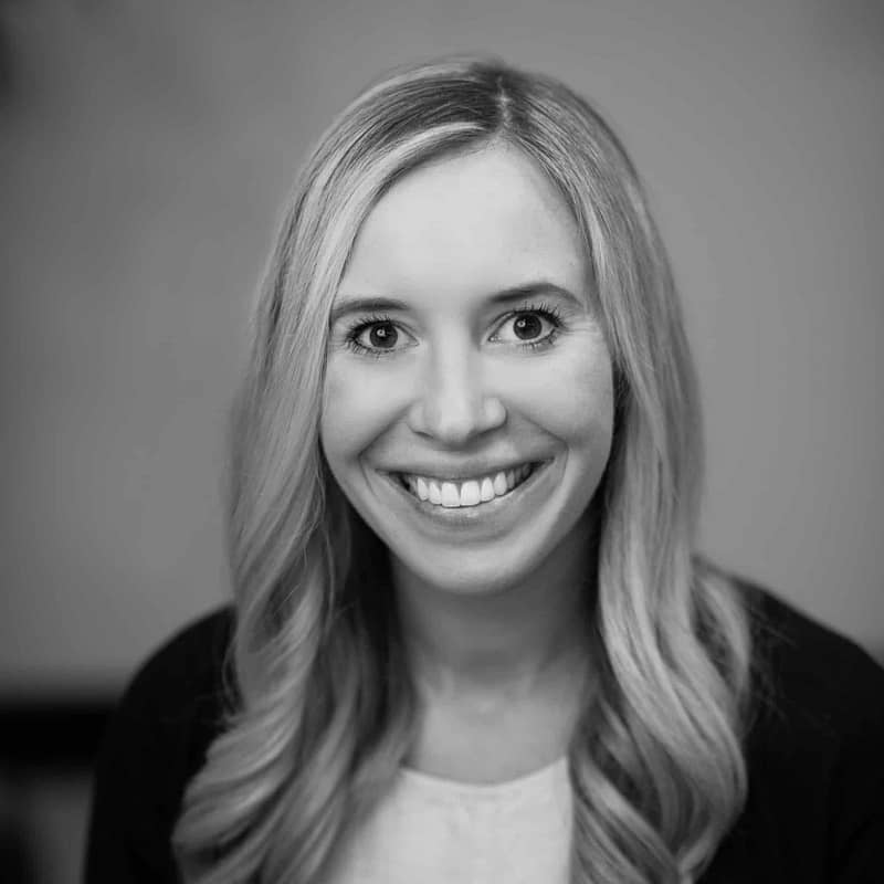 Emily Payment headshot in black and white in office space