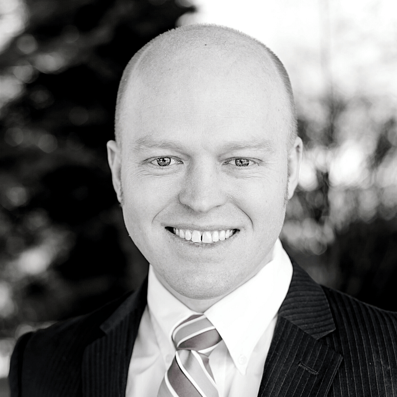 Jeremy McAdam's headshot in black and white.