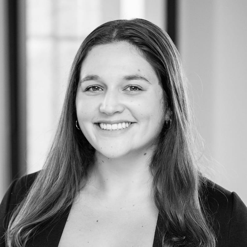 Breana Navarro's headshot in black and white in office space.