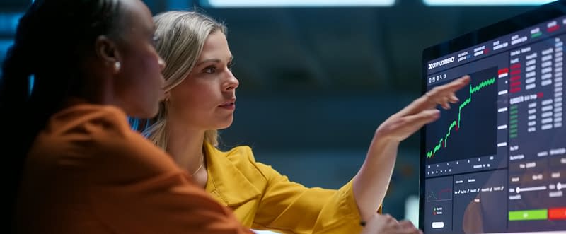 Business people, computer and screen with stock market, teamwork and connection with internet, trading and charts. Staff, investor and women with a pc, cooperation and fintech with finance and graphs