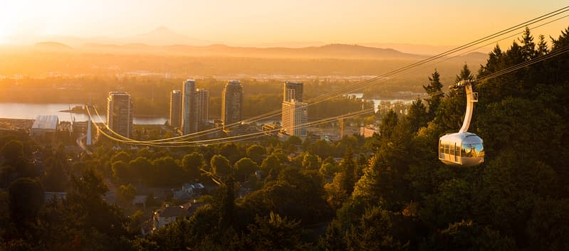 Aerial tram in Portland, Oregon transporting people to and from the hilltop with Oregon Health and Science University (OHSU) and a beautiful view on mount Hood and mount st. Helens, where Aldrich Wealth was named among one of Portland Business Journal's 2026 Money Management FIrms with the Most Oregon + SW Washington Assets.