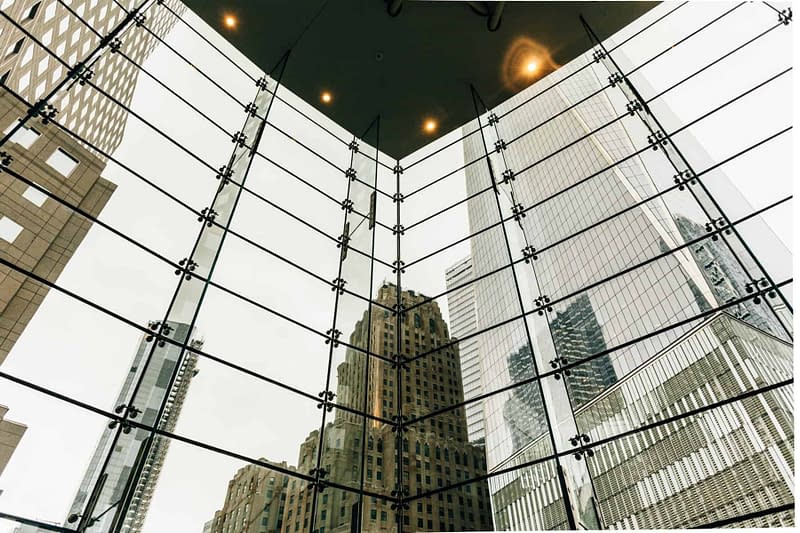 tall sky scrapers office buildings reflecting off office window reelection
