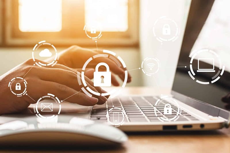 Businessman working on laptop. Protection network security computer and safe your data concept. Digital crime by an anonymous hacker
