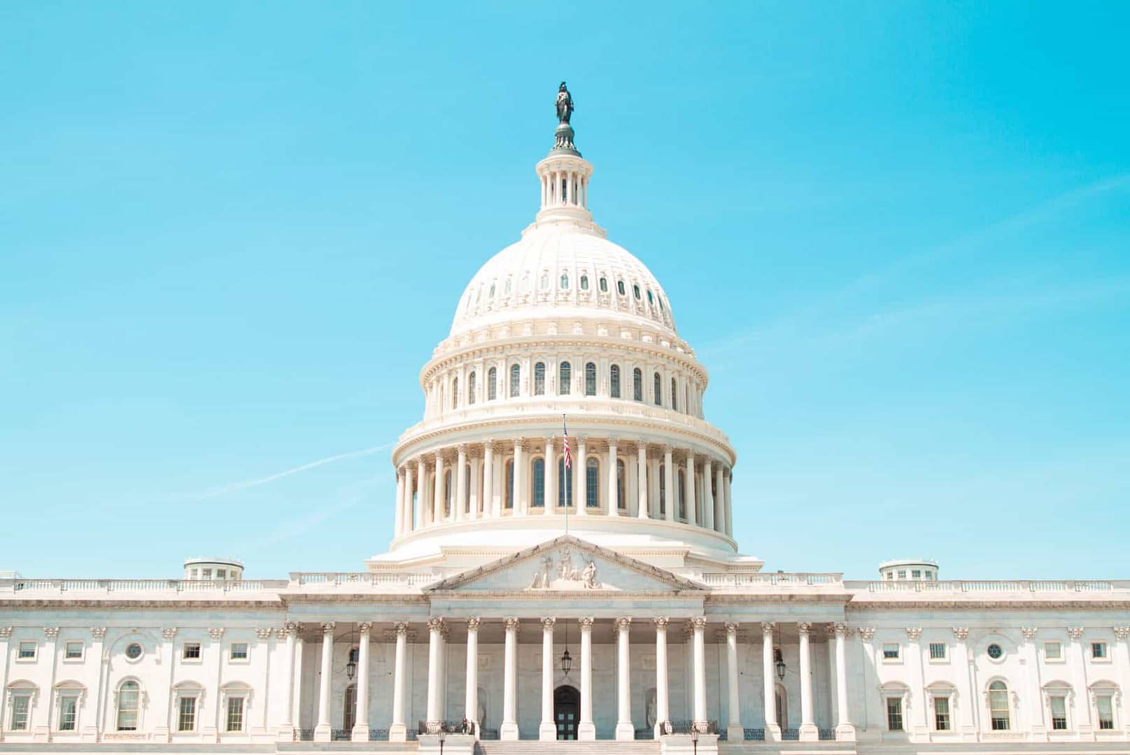 Photo of the United States Capital building in Washington DC on a clear day.