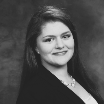 Courtney Westra's headshot in black and white.