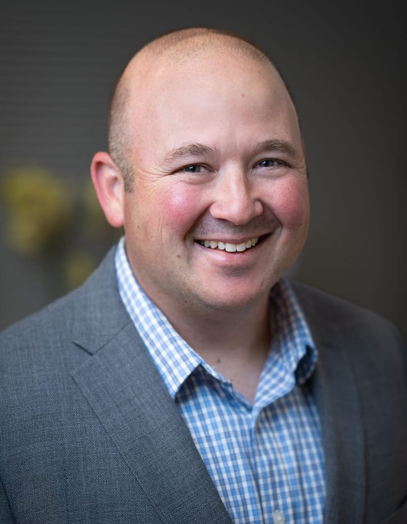Josh Axelrod's, Aldrich COO, headshot in an office space.