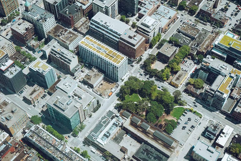 A bird's eye view of city skyscrapers, in which Aldrich provides commercial real estate tax and accounting services.