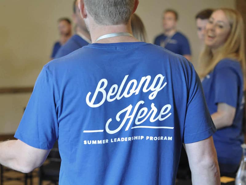 Man wearing shirt that says "Belong Here" at Summer Leadership Program