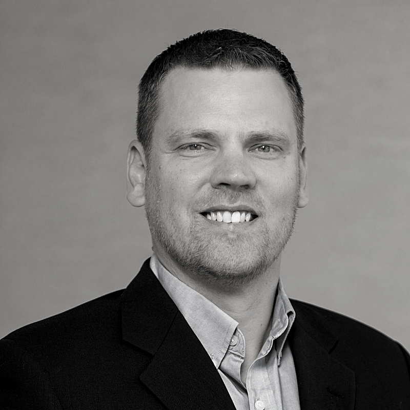 Brian Jarvis's headshot in black and white.