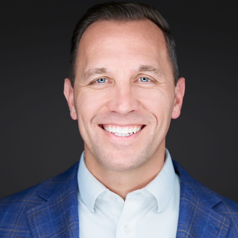 Matthew Drake of BaseRock Partners' headshot in front of a black background.