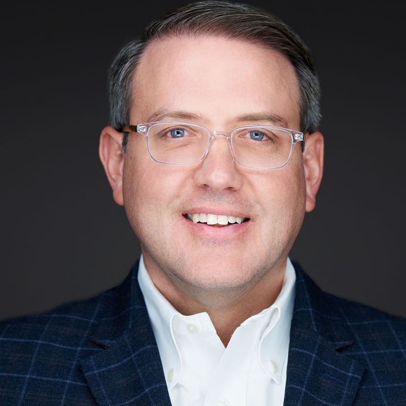 Scott Duncan of BaseRock Partners' headshot in front of a dark background.