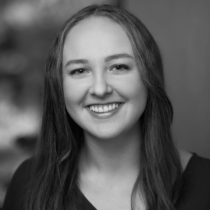Elizabeth Hoyt's headshot in black and white in office space.