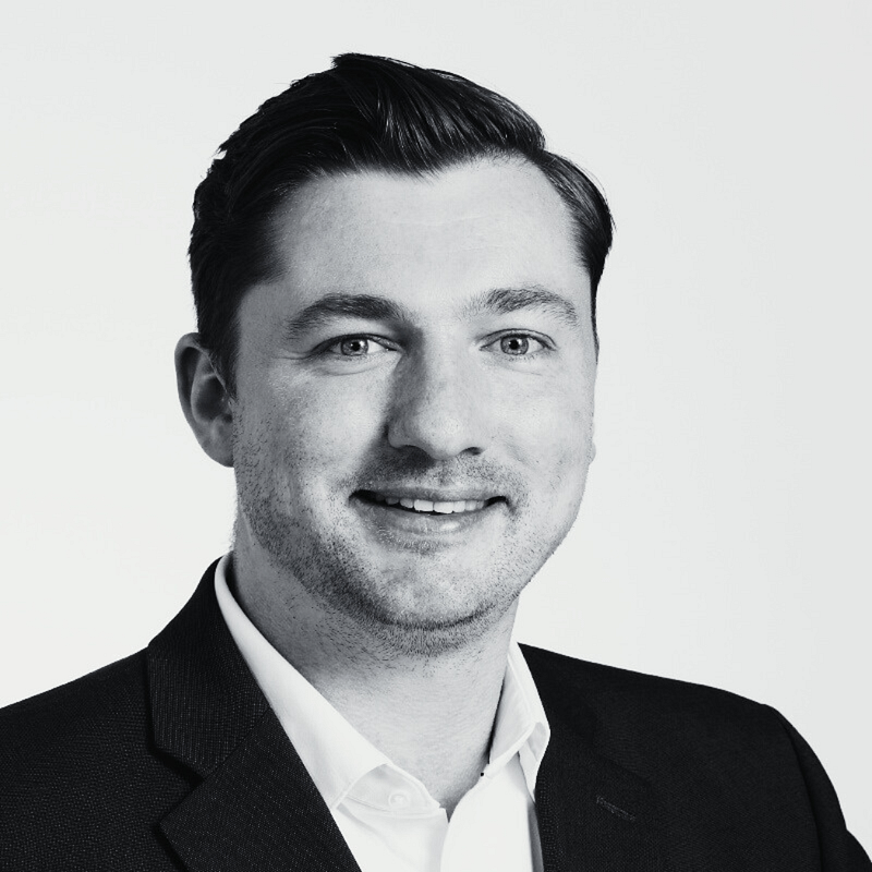 Drew McCaulay's headshot in black and white.