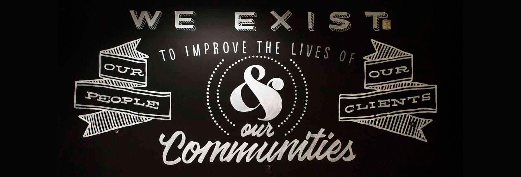 A black and white graphic with our Aldrich why stating "we exist to improved the lives of our people, our clients, and our communities.