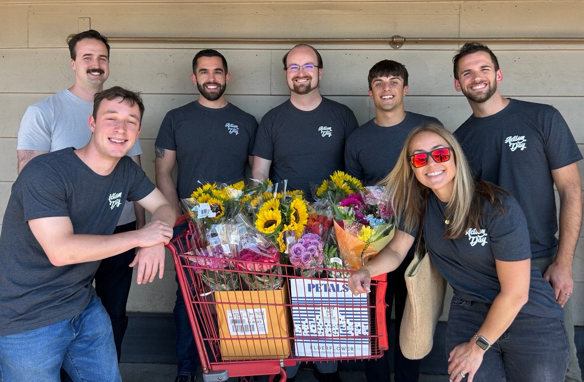 Group photo of Action Day volunteers in Lake Oswego with the flowers they will arrange for assisted living homes.