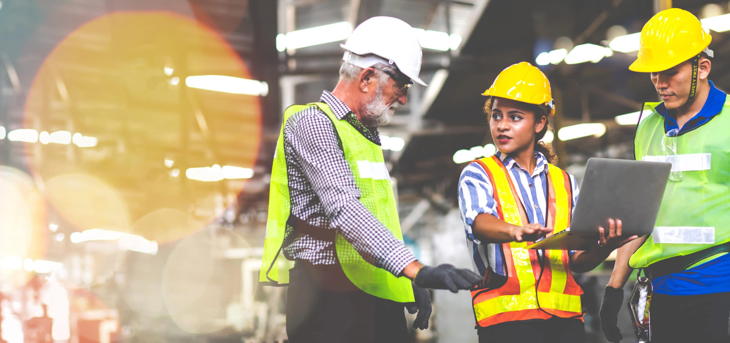 Professional Mechanical Engineer team Working on Personal Computer at Metal lathe industrial manufacturing factory. Engineer Operating lathe Machinery. Product quality Inspection