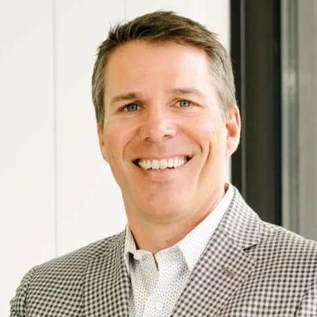 Greg Togni, 180one Managing Partner, headshot in office space.