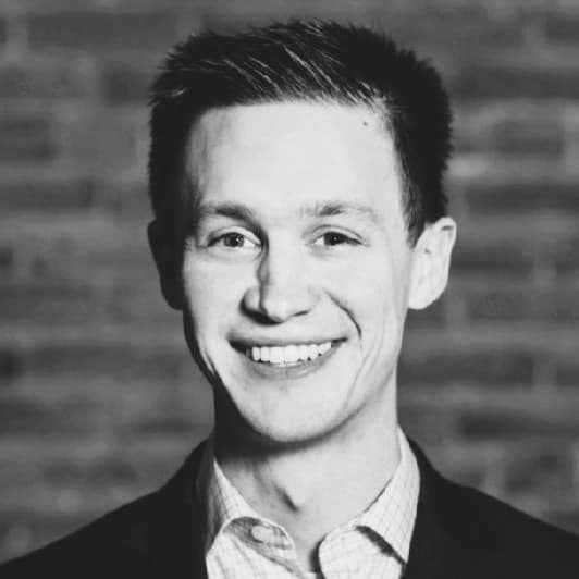 Tyler Jessee's headshot in black and white.