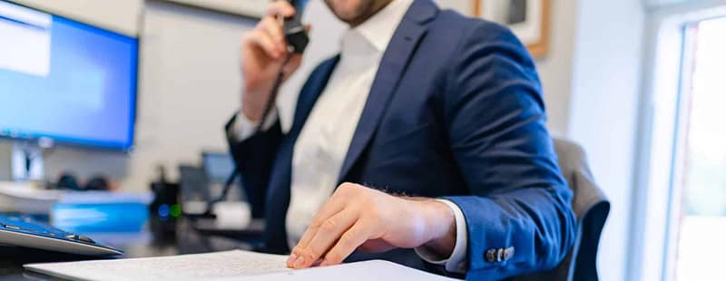 Consultant takes a client call to discuss creating an effective process assessment