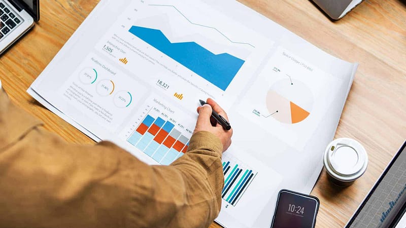 A person holding a pen over a