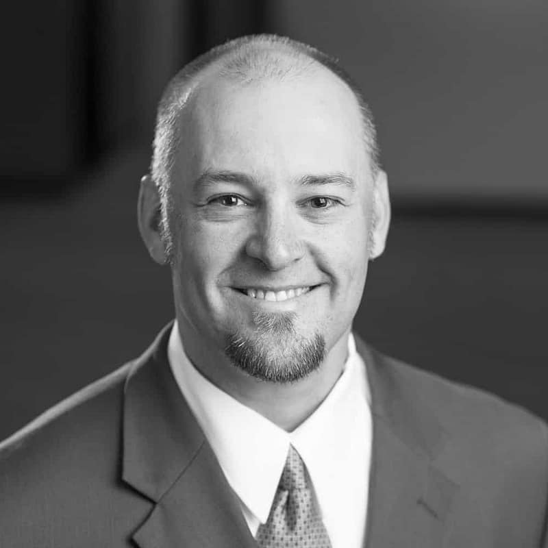 Matt Van Doren's headshot in black and white in office space.