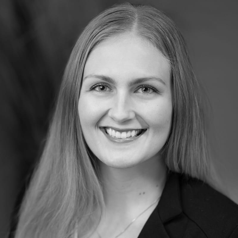 Annabel Kroontje headshot in black and white in office space.