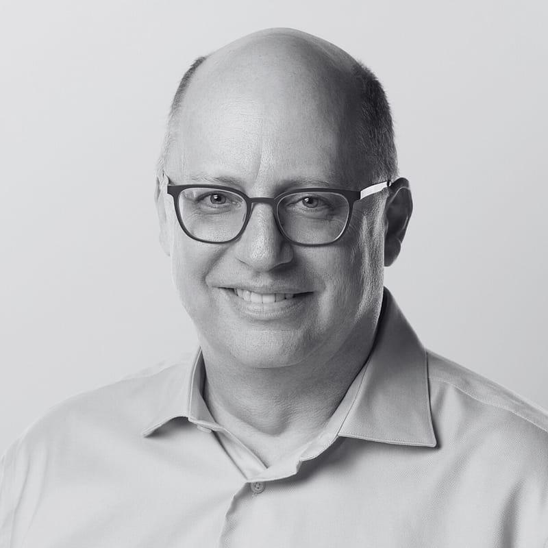 Chris Barron's headshot in black and white.