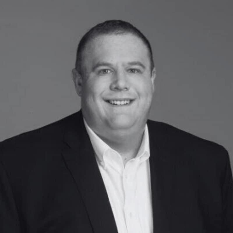 Ian Prescott's headshot in black and white.