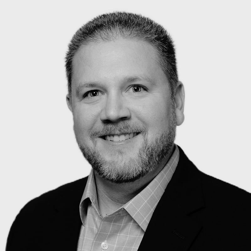 Chris Clasbey, Regulatory Consultant, headshot in black and white.