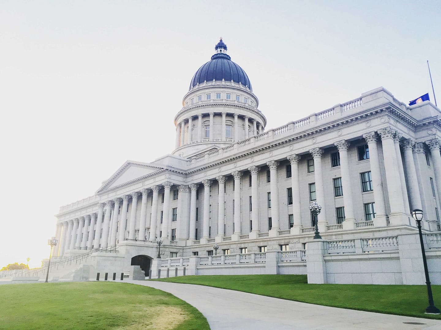 nonprofit + government building with green landscape during daylight.