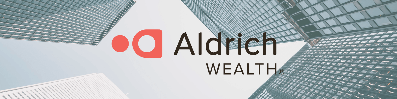 Aldrich Wealth Logo with glass skyscrapers in daylight