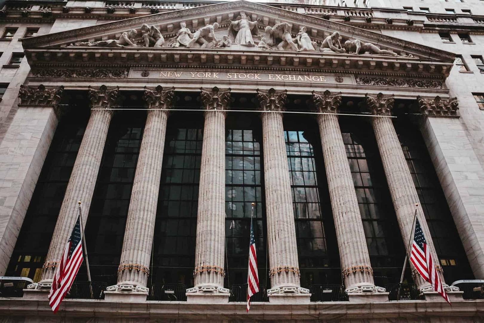 New York Stock Exchange building with American flags