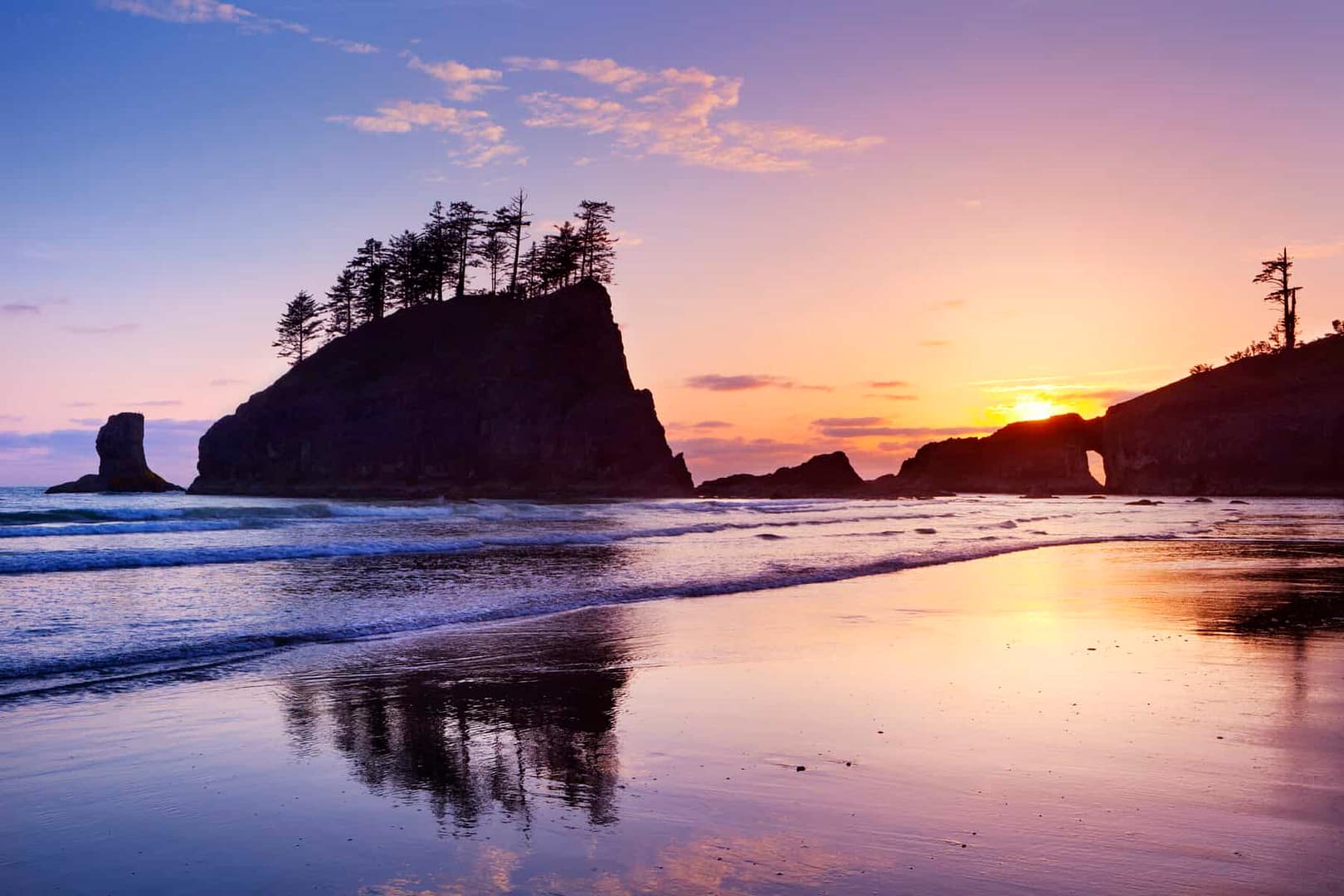 Purple sunrise over beach in the Pacific Northwest.