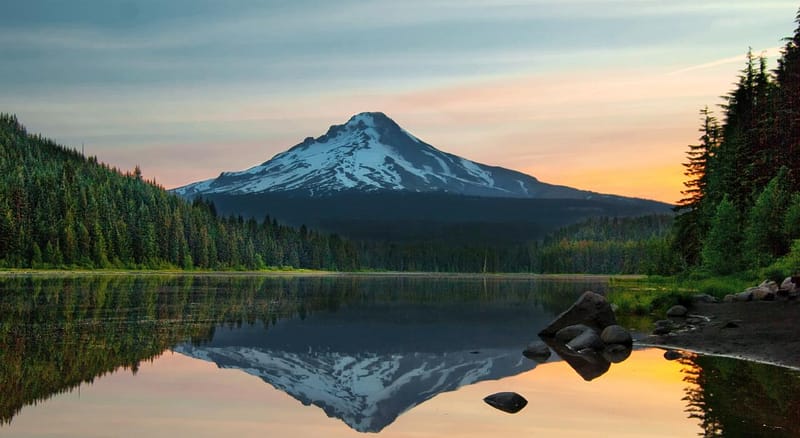 A photo at sunset overlooking Trillium Lake to a snow capped Mount Hood in Oregon.