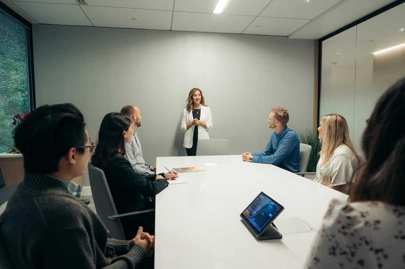 Kathy Peterson presenting in bright lit conference room in Lake Oswego office location Lake