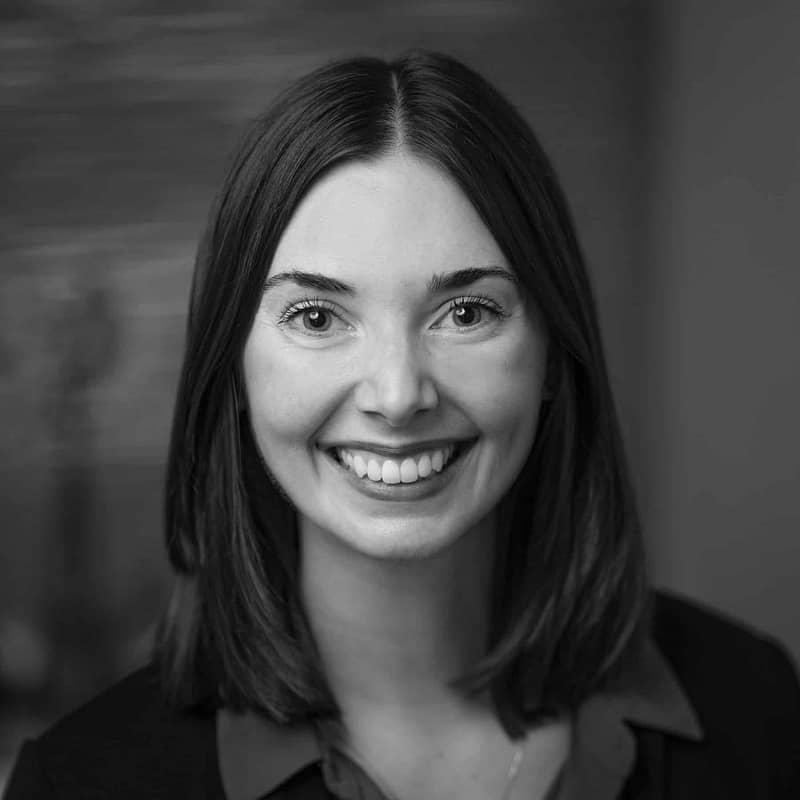 Emma-Anne Lonsford's headshot in black and white in office space.